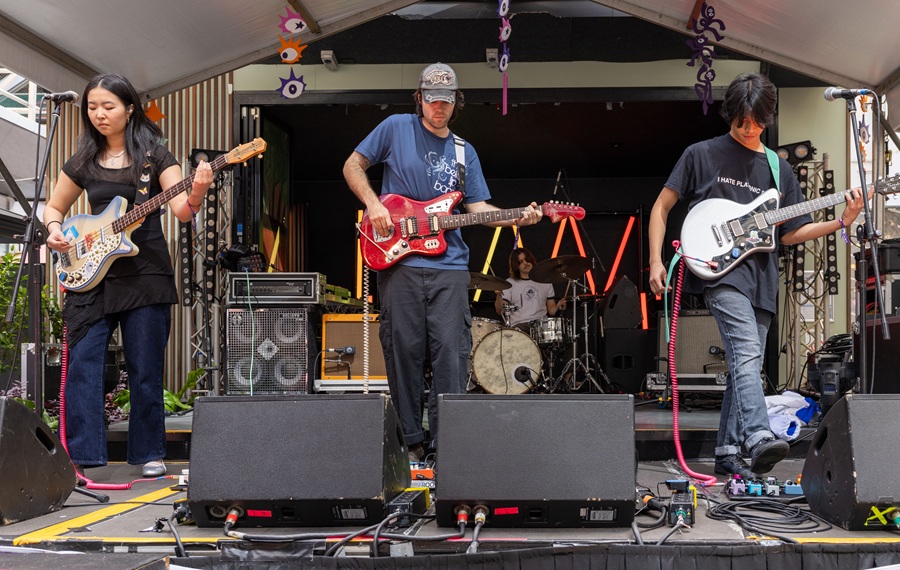 Blue Diner performing at Queensland on Tour event at BIGSOUND 2025. The band includes 3 guitarists and one drummer performing on stage during the event.